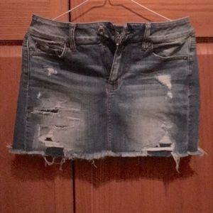 American Eagle size 4 jean skirt. Stretchy. Dark and distressed rinse.